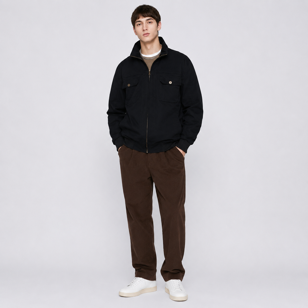 Man wearing a casual zip-up jacket in black