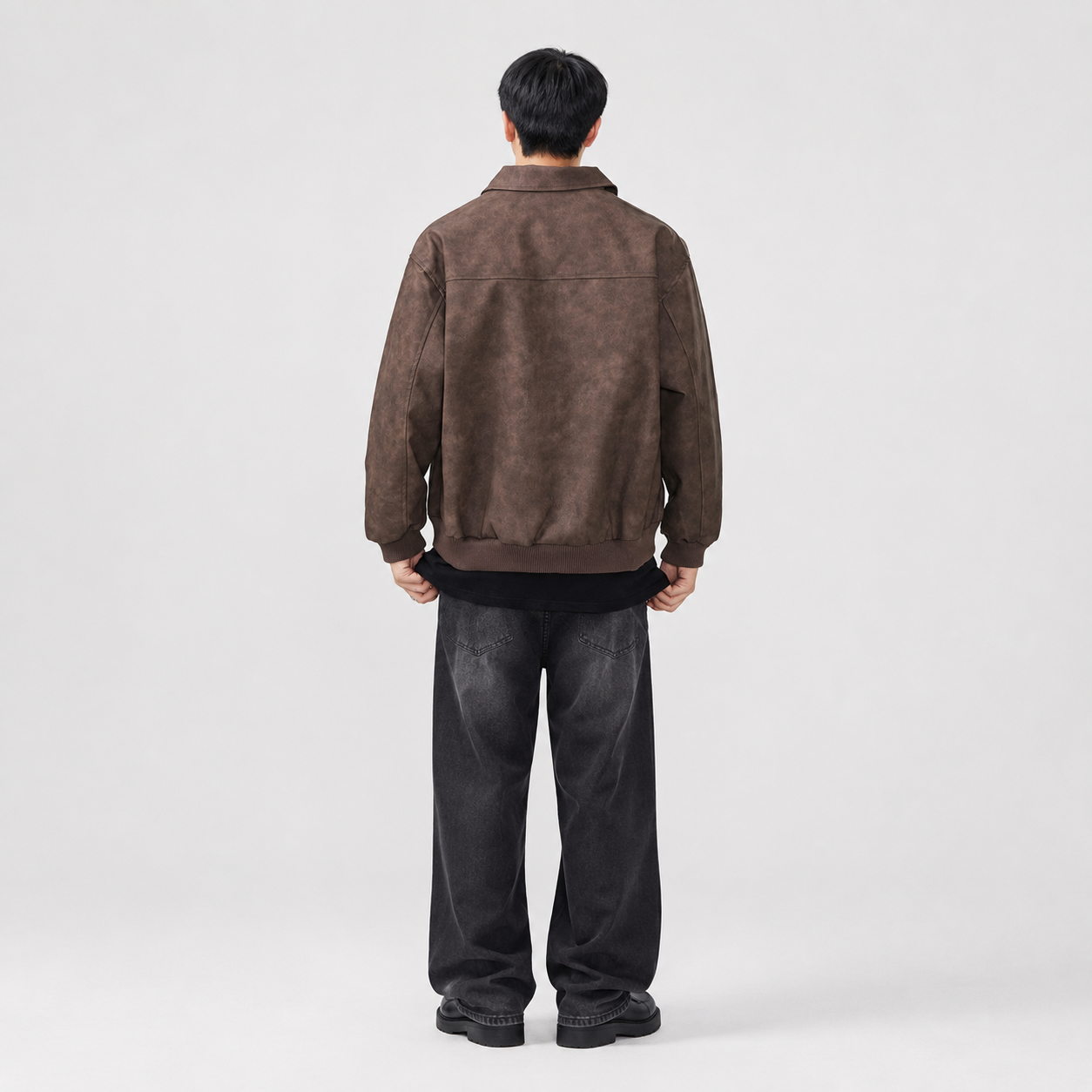 Back view of a men's zip-up jacket