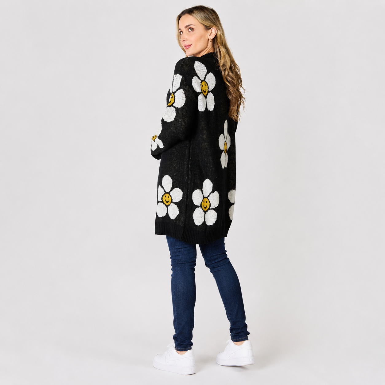 Front view of a women's floral knit cardigan