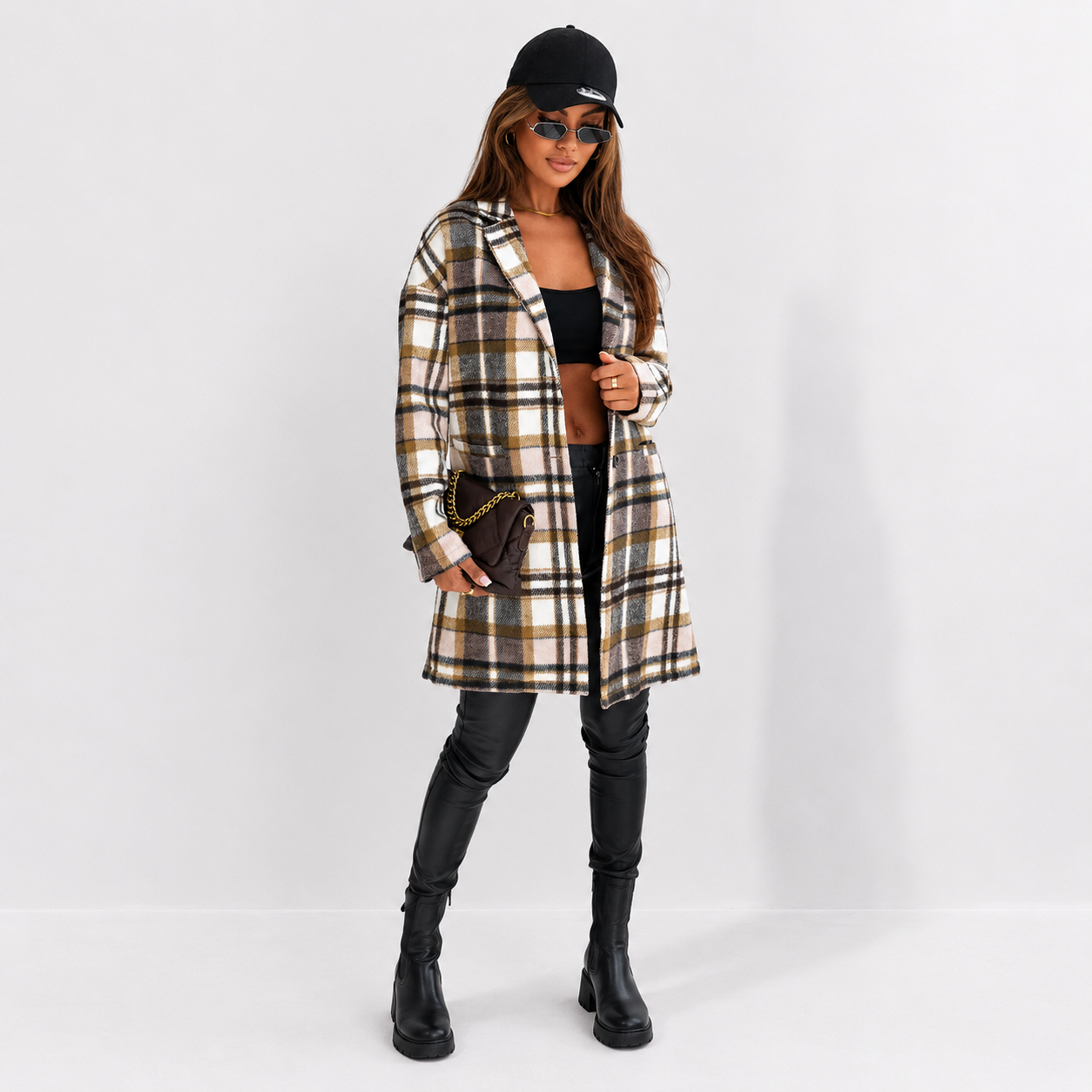 Front view of women's plaid longline jacket with pockets