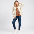 Woman wearing a cream textured jacquard jacket with button front closure