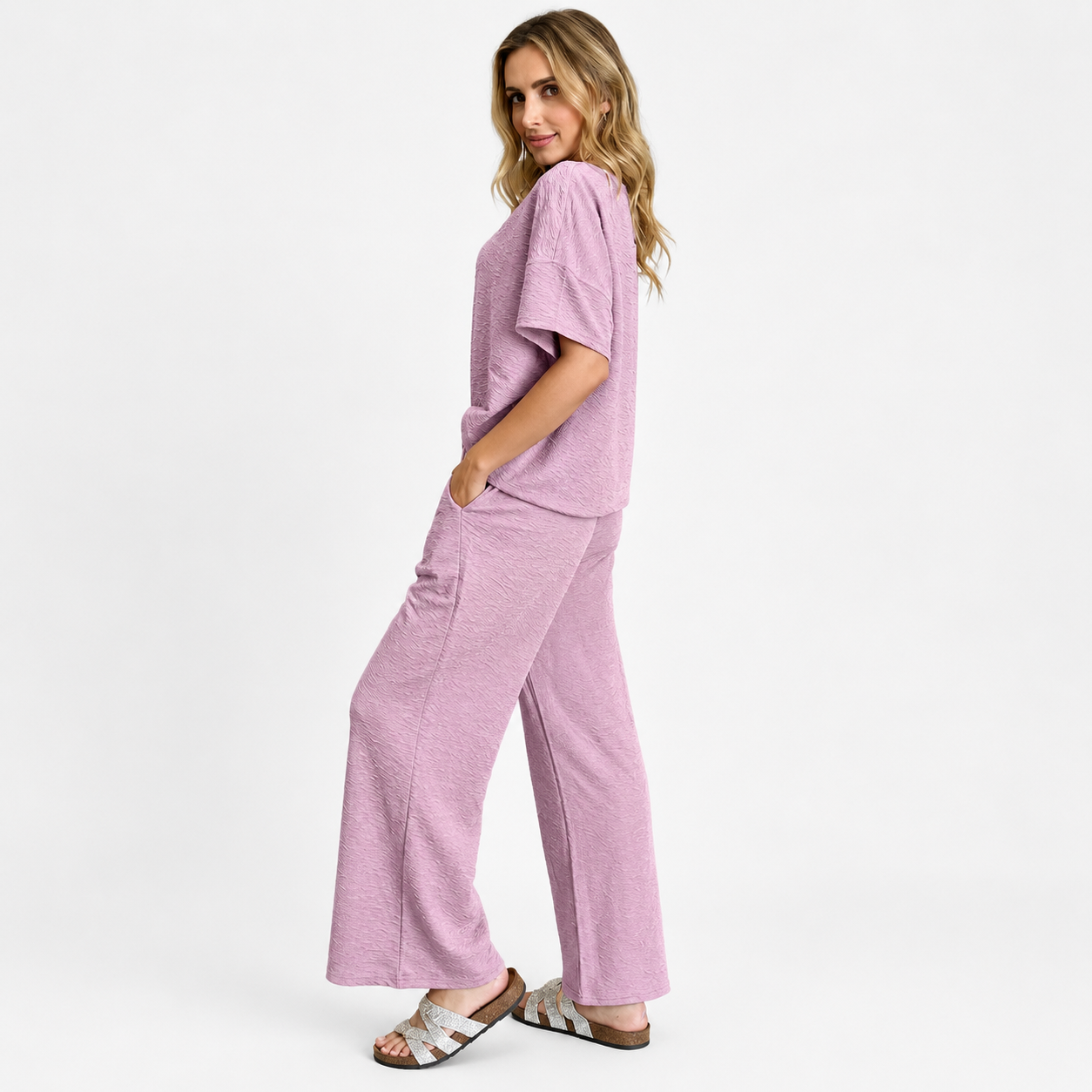 Side view of a women's two-piece pants outfit