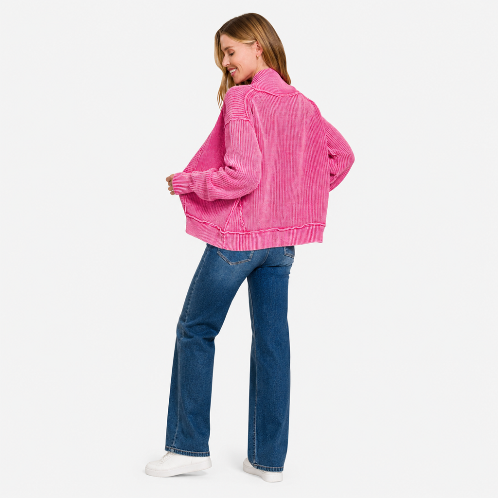 Woman wearing a pink washed button cardigan with long sleeves