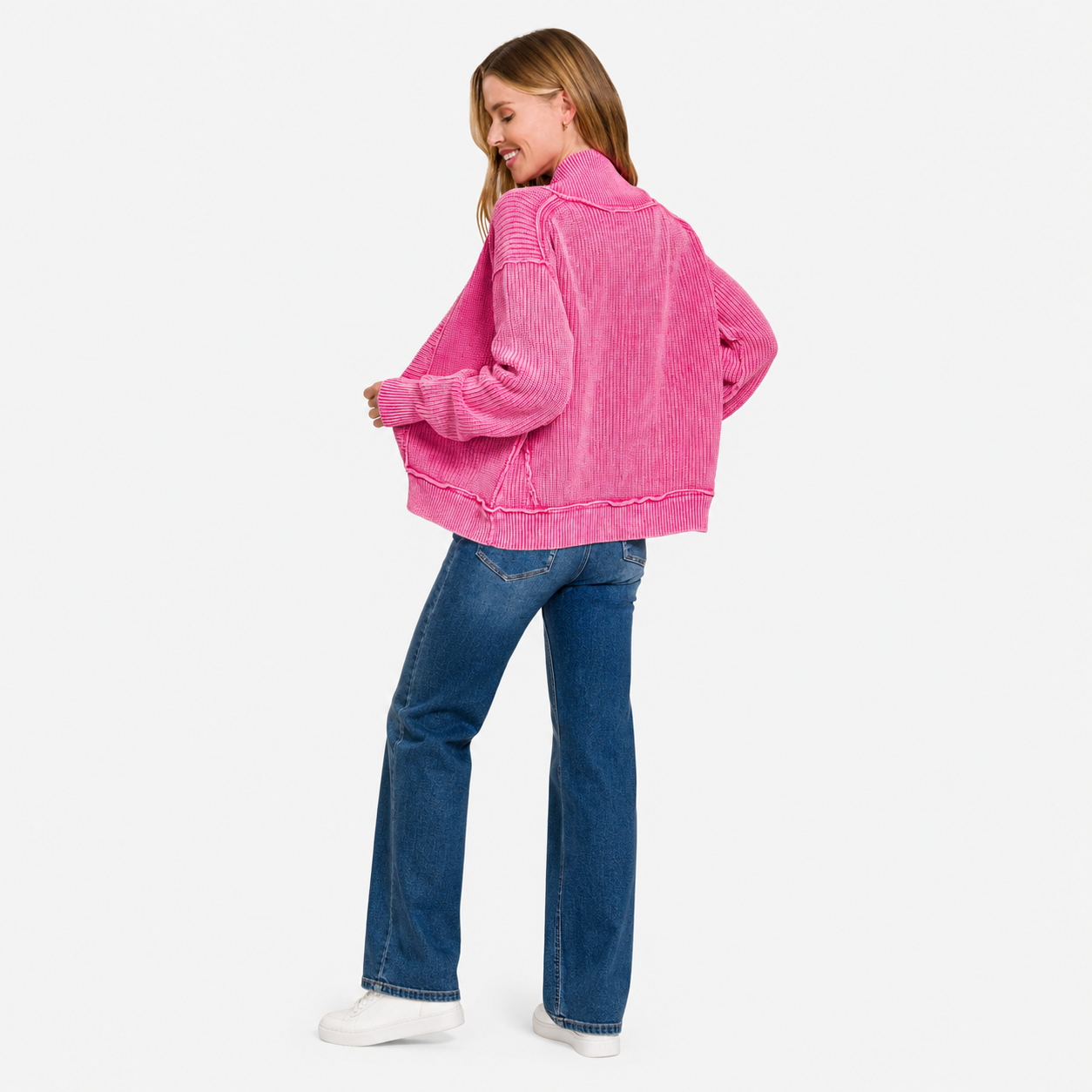 Woman wearing a pink washed button cardigan with long sleeves